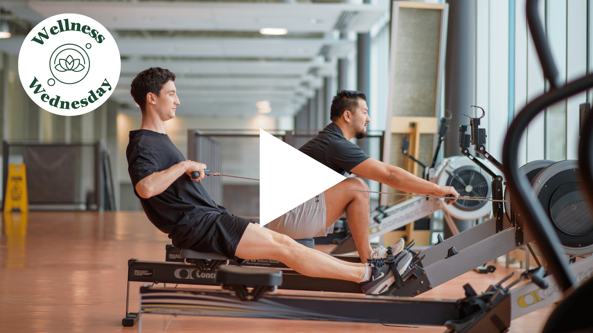 Two individuals working out on eqiupment
